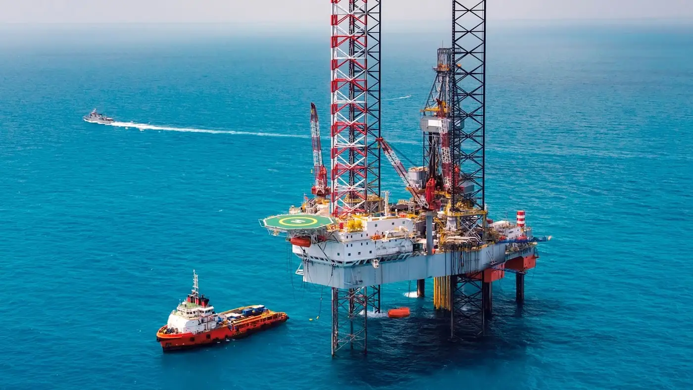 Offshore jack-up drilling rig and supply vessel in the Gulf of Mexico